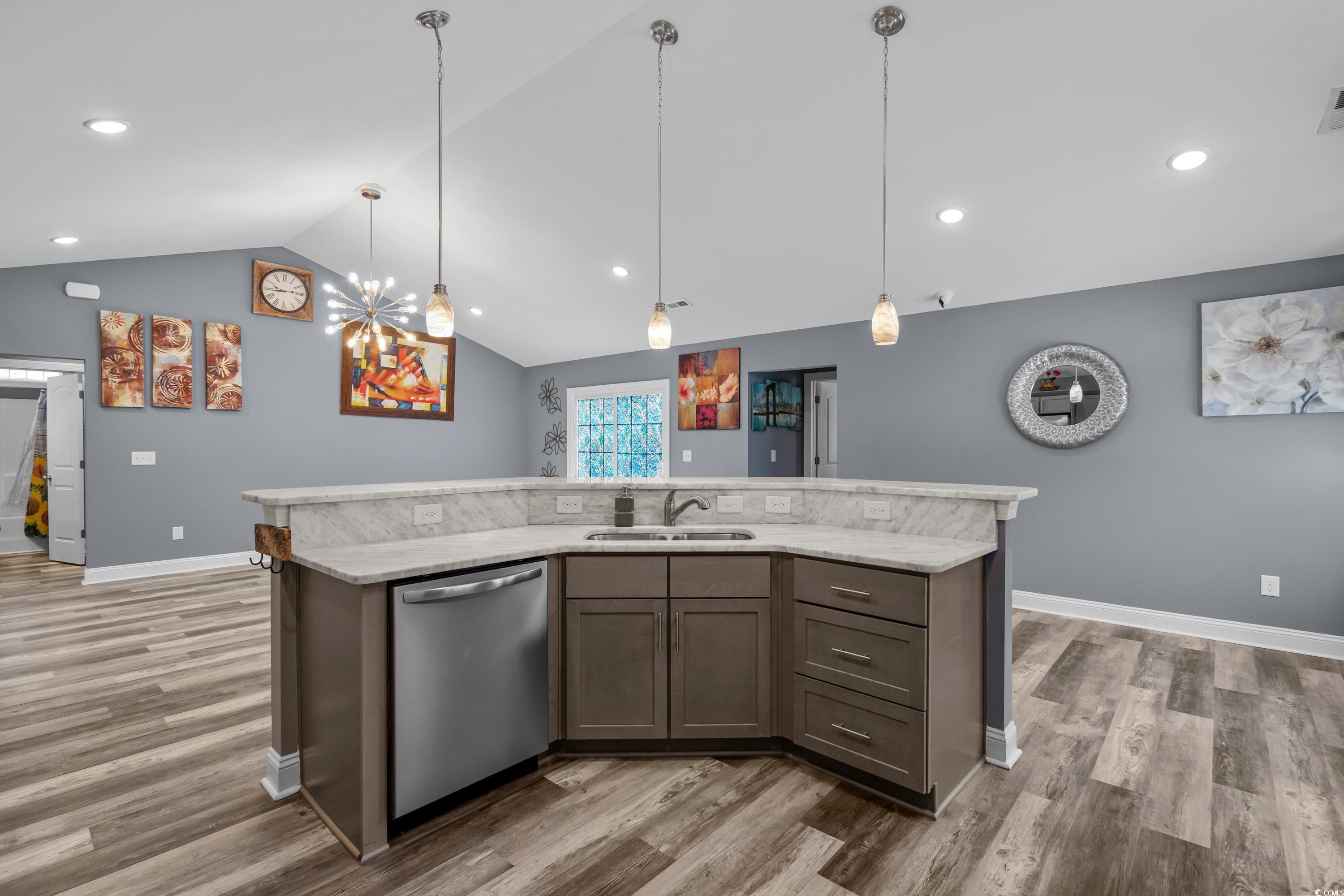 3836 Journeys End Road Murrells Inlet, SC 29576 - Photo 16 of 40 Kitchen with dishwasher, a sink, vaulted ceiling,