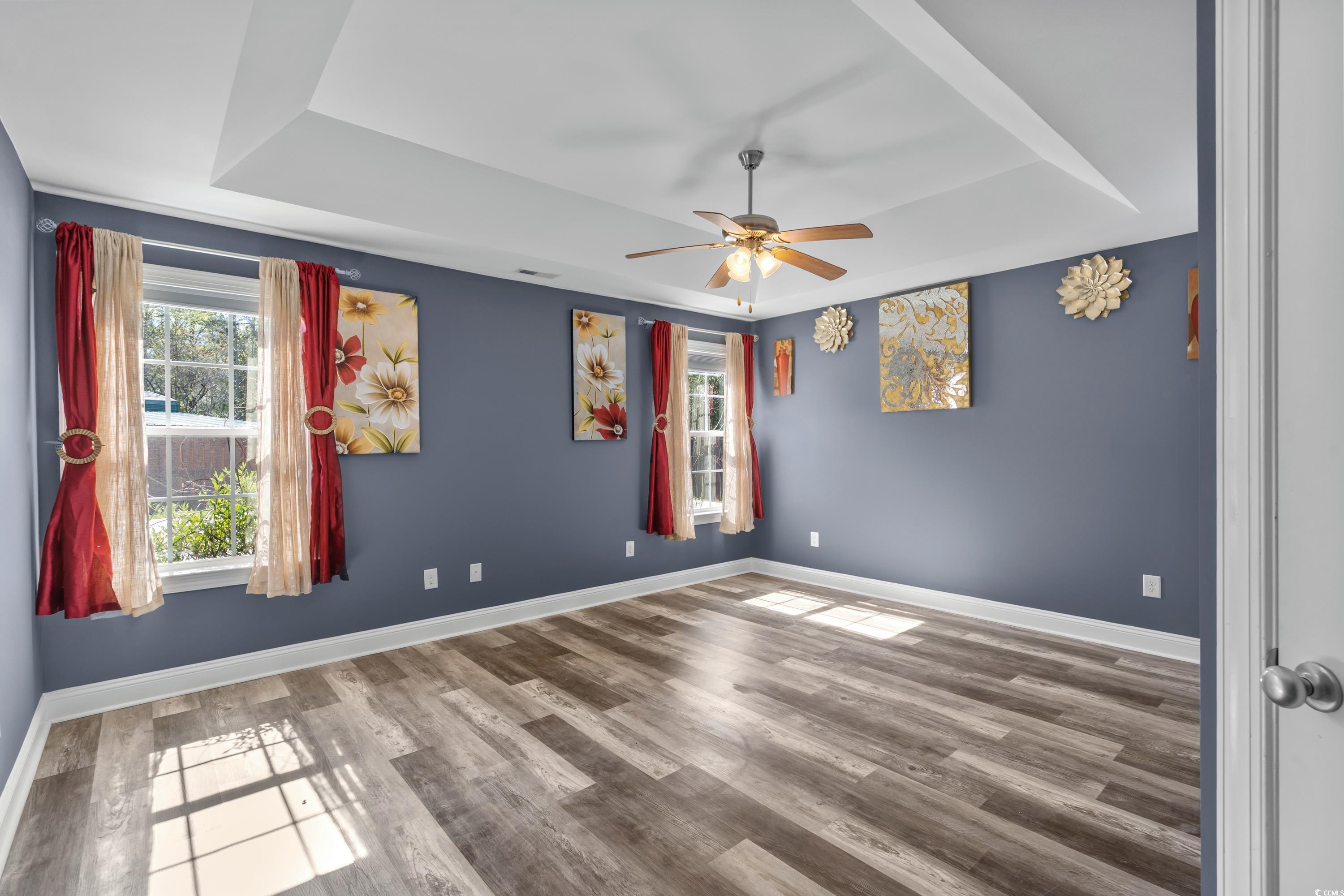 3836 Journeys End Road Murrells Inlet, SC 29576 - Photo 18 of 40 Spare room featuring a raised ceiling, baseboards,