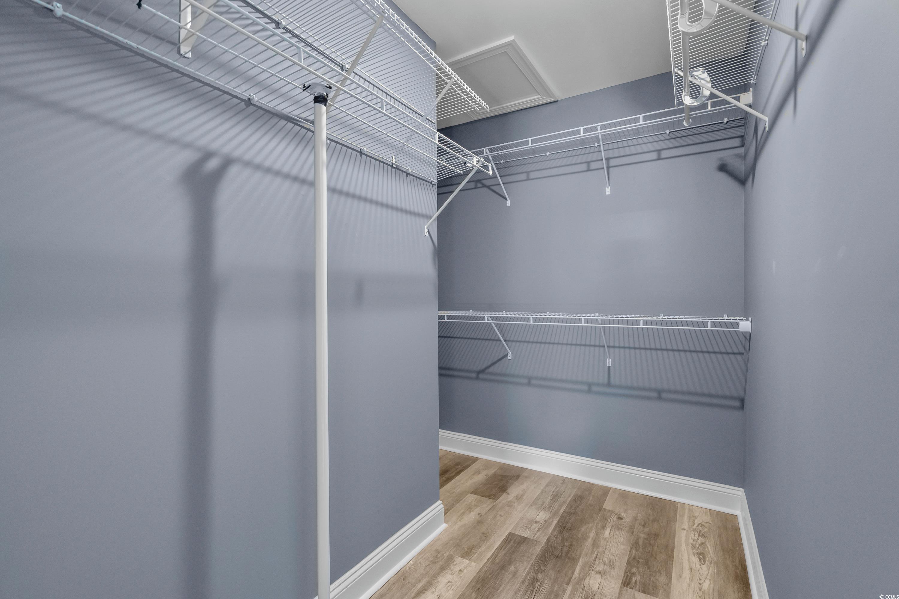 3836 Journeys End Road Murrells Inlet, SC 29576 - Photo 23 of 40 Walk in closet featuring wood finished floors