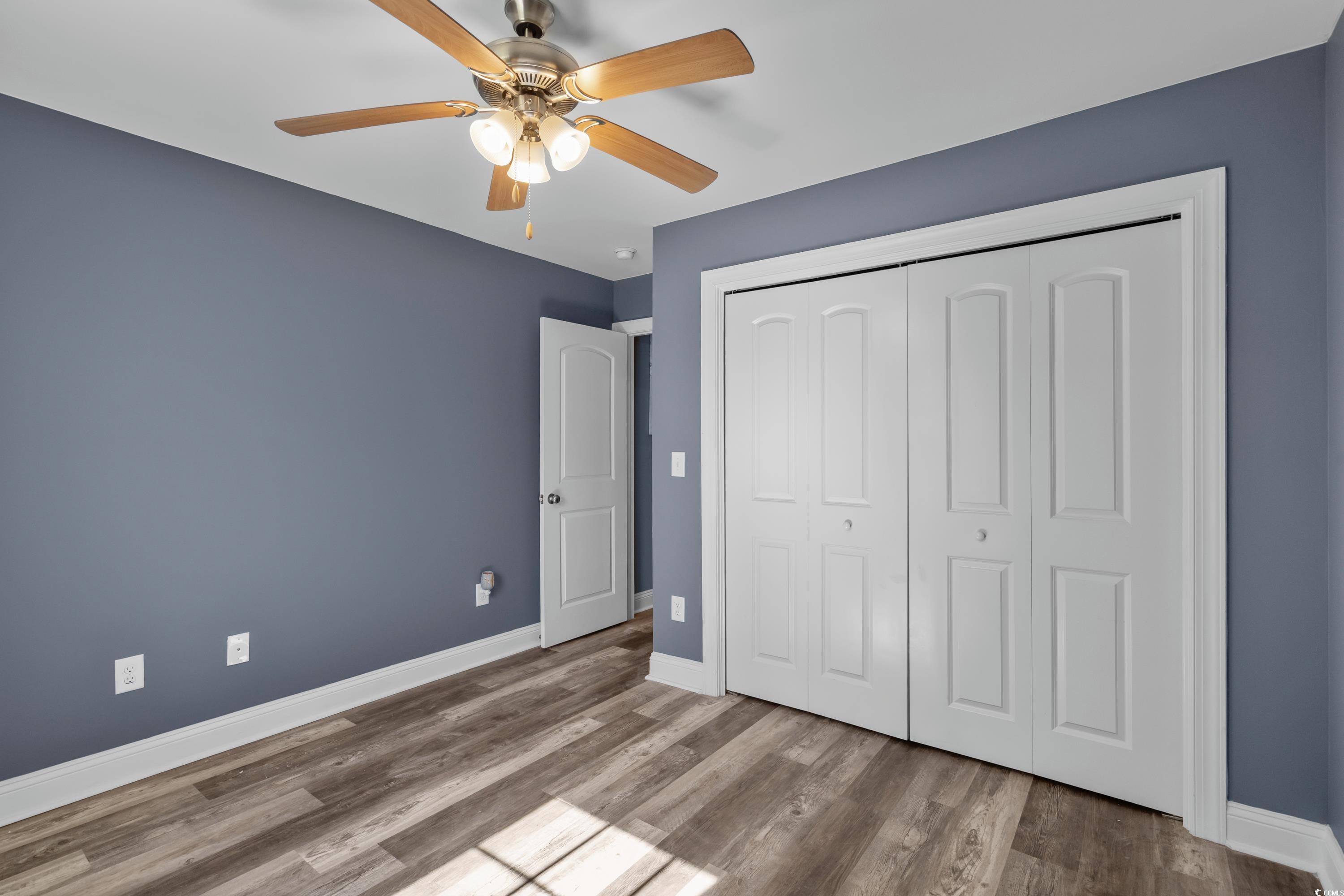 3836 Journeys End Road Murrells Inlet, SC 29576 - Photo 26 of 40 Unfurnished bedroom with baseboards, a closet, woo