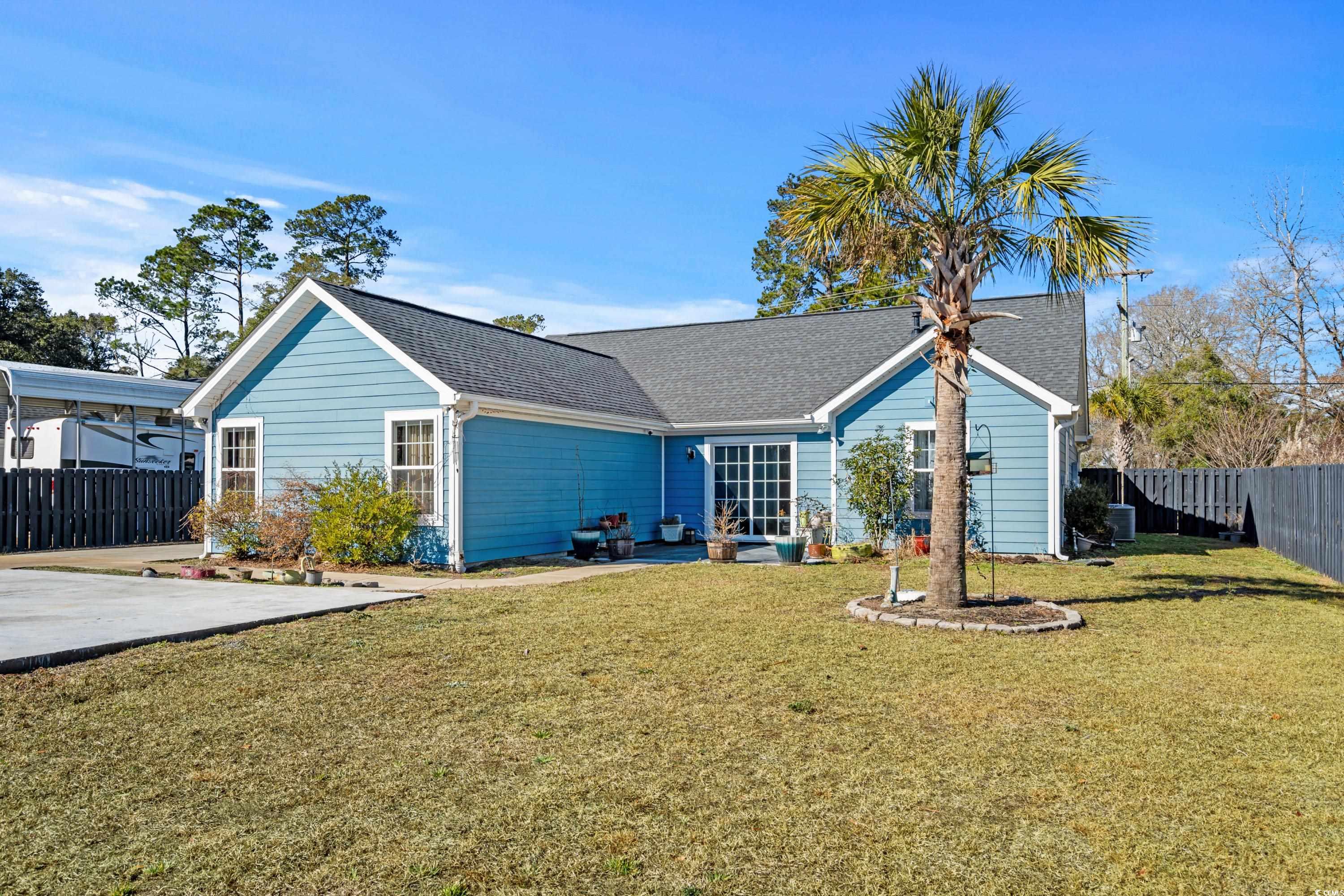 3836 Journeys End Road Murrells Inlet, SC 29576 - Photo 32 of 40 Back of house with a yard