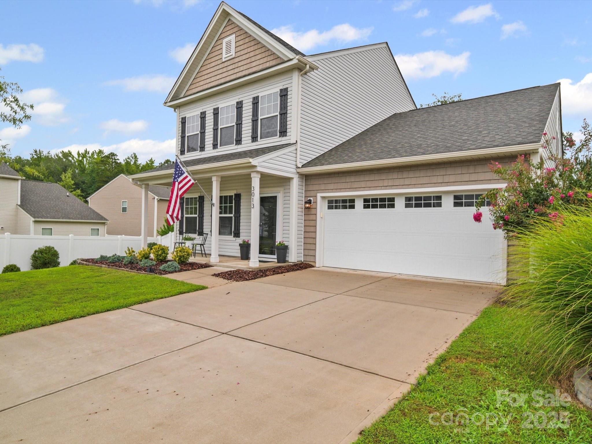 3013 Riker Street Clover, SC 29710 - Photo 3 of 39 a view of a big house with a yard and plants