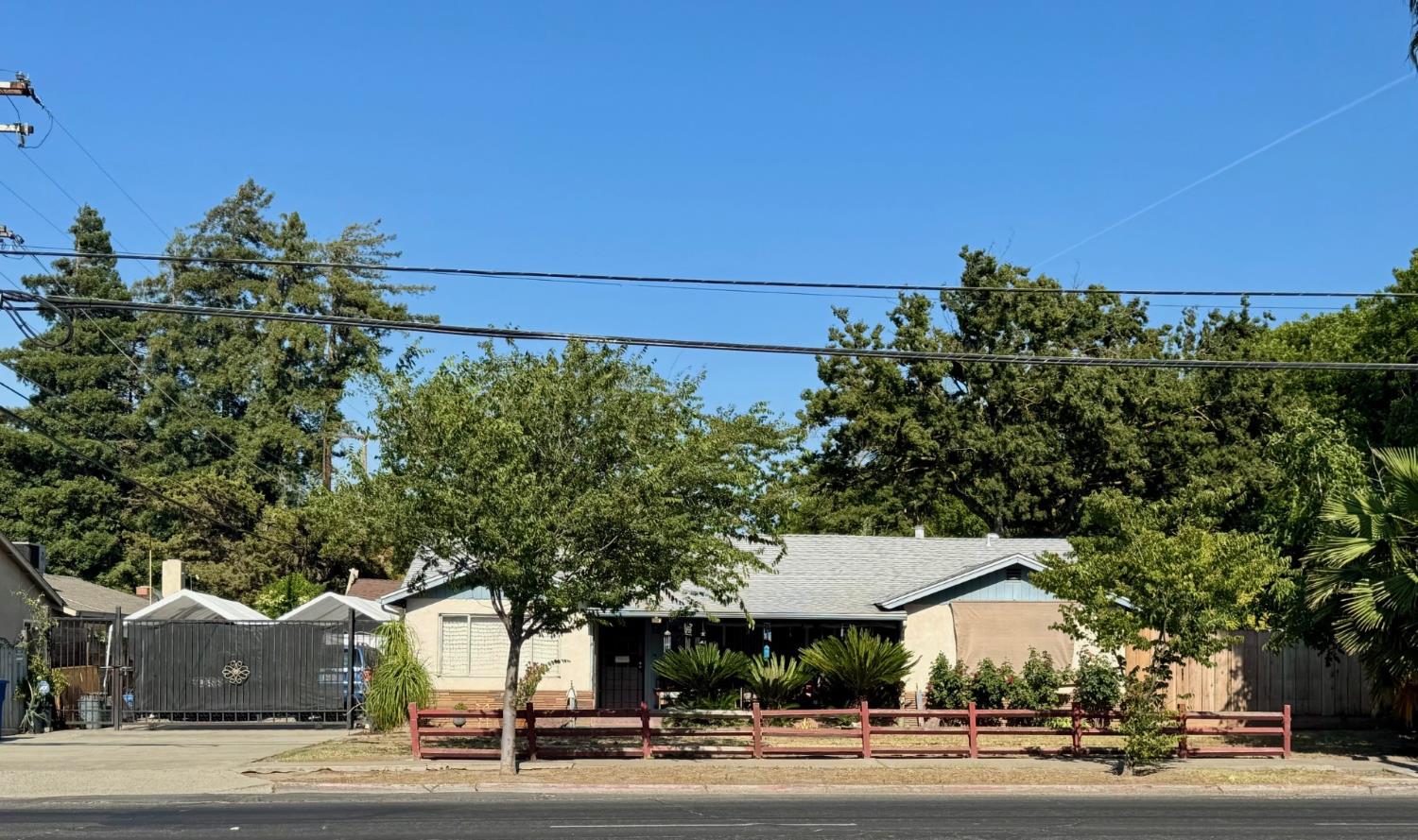 a view of a city street and trees