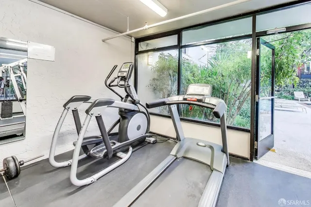 a view of a patio with dining table and chairs