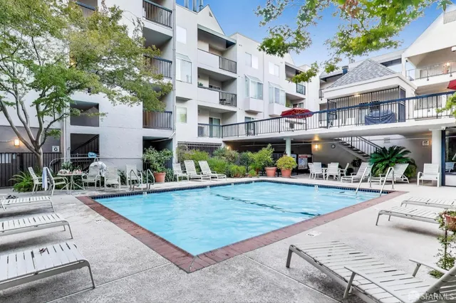 a view of a swimming pool with a patio