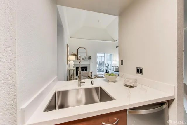 a kitchen with a sink and a refrigerator