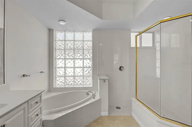 a bathroom with a bathtub and a shower