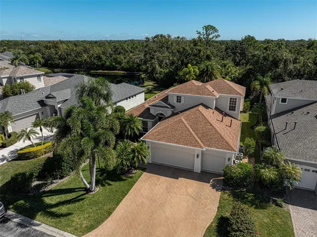 an aerial view of a house with lake view
