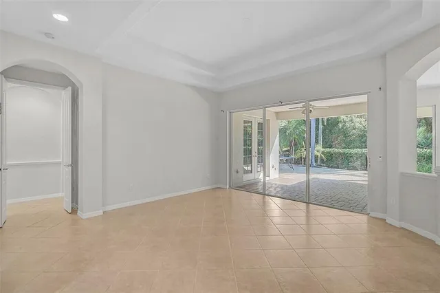 a view of an empty room with glass door