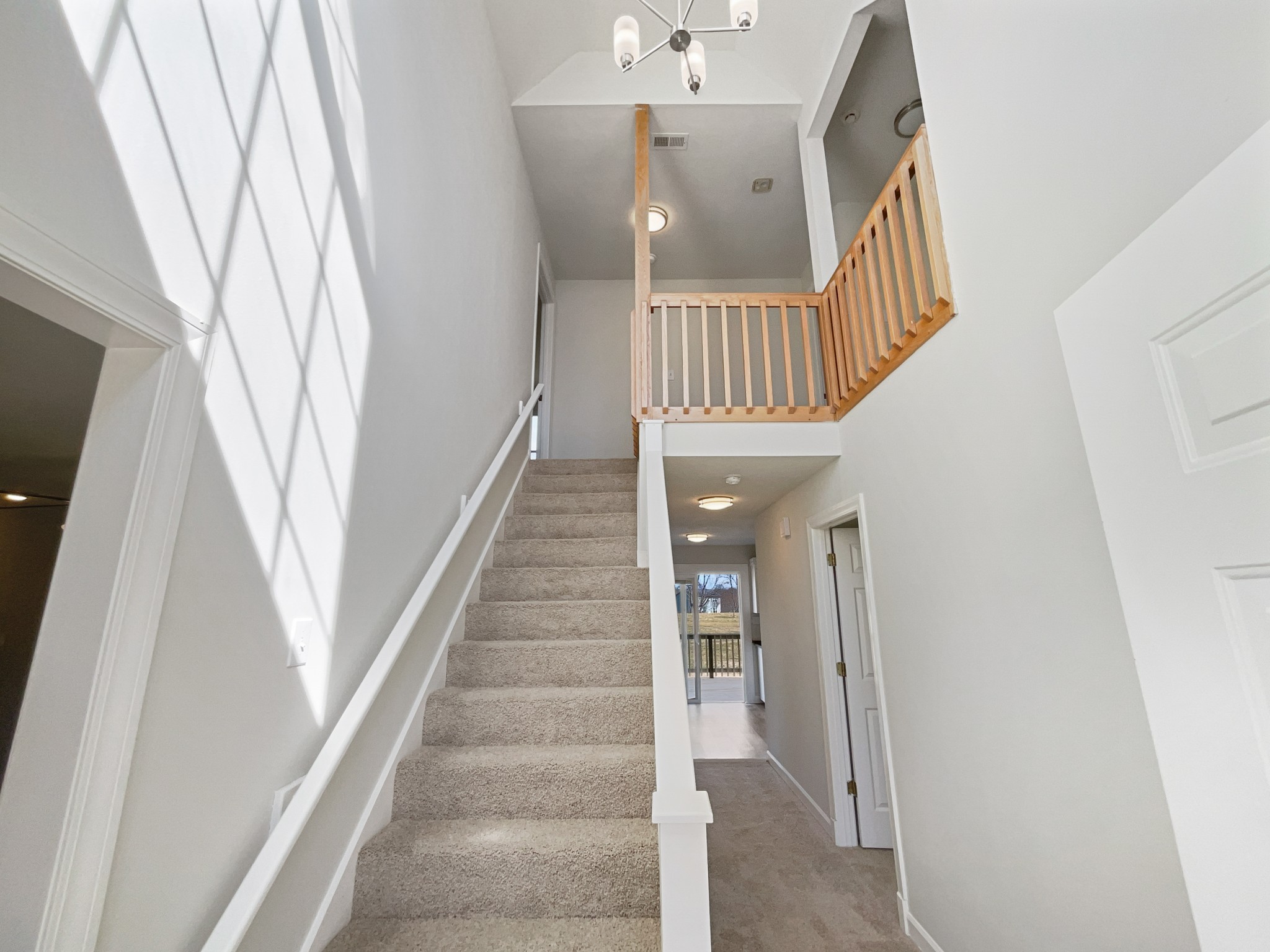 1683 South Walker Road Pleasant View, TN 37146 - Photo 11 of 26 a view of staircase with railing and white walls