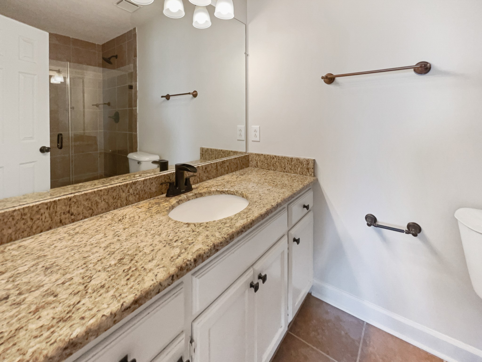 1683 South Walker Road Pleasant View, TN 37146 - Photo 15 of 26 a bathroom with a granite countertop sink and a mirror