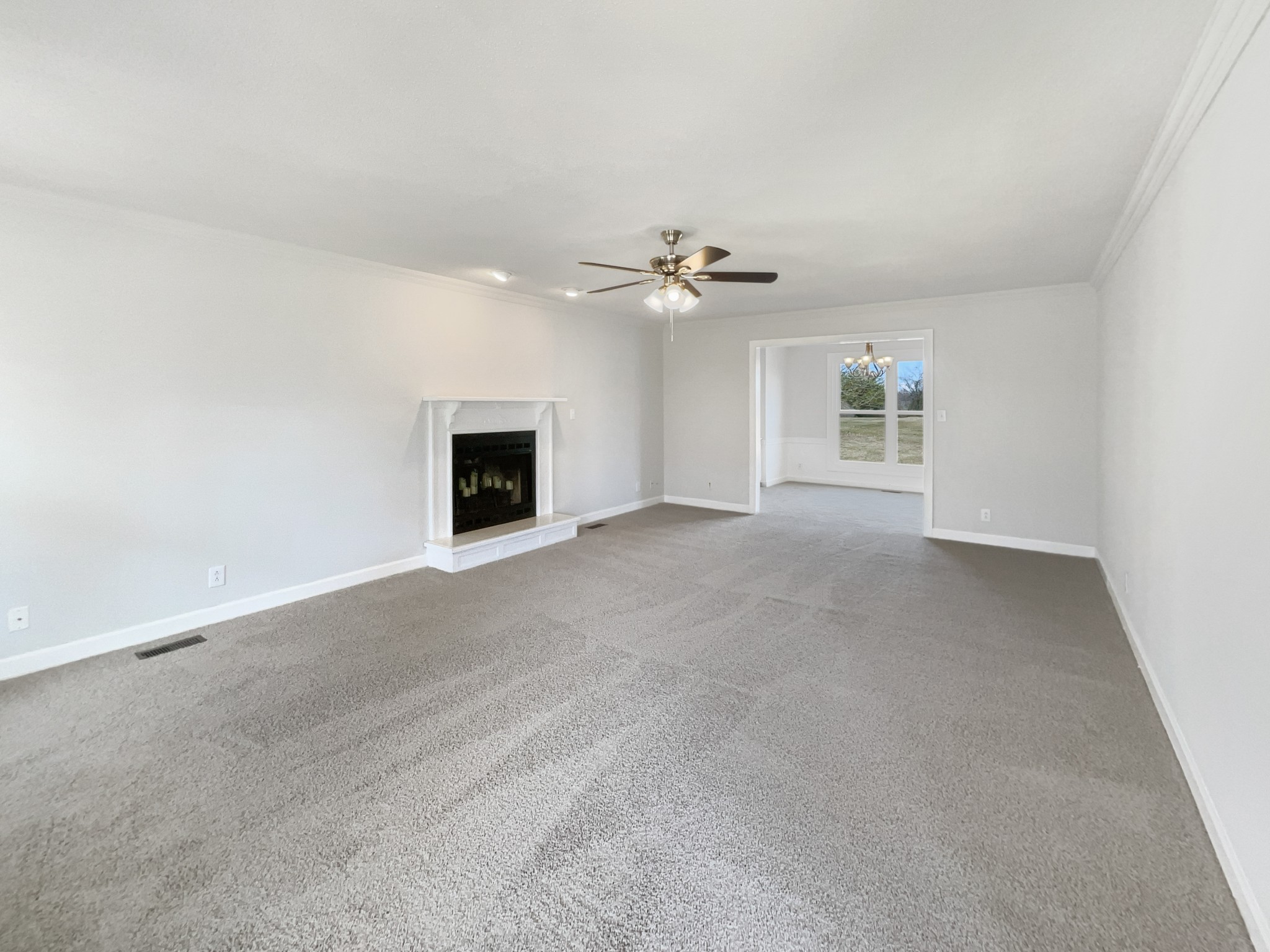 1683 South Walker Road Pleasant View, TN 37146 - Photo 3 of 26 an empty room with windows and fireplace
