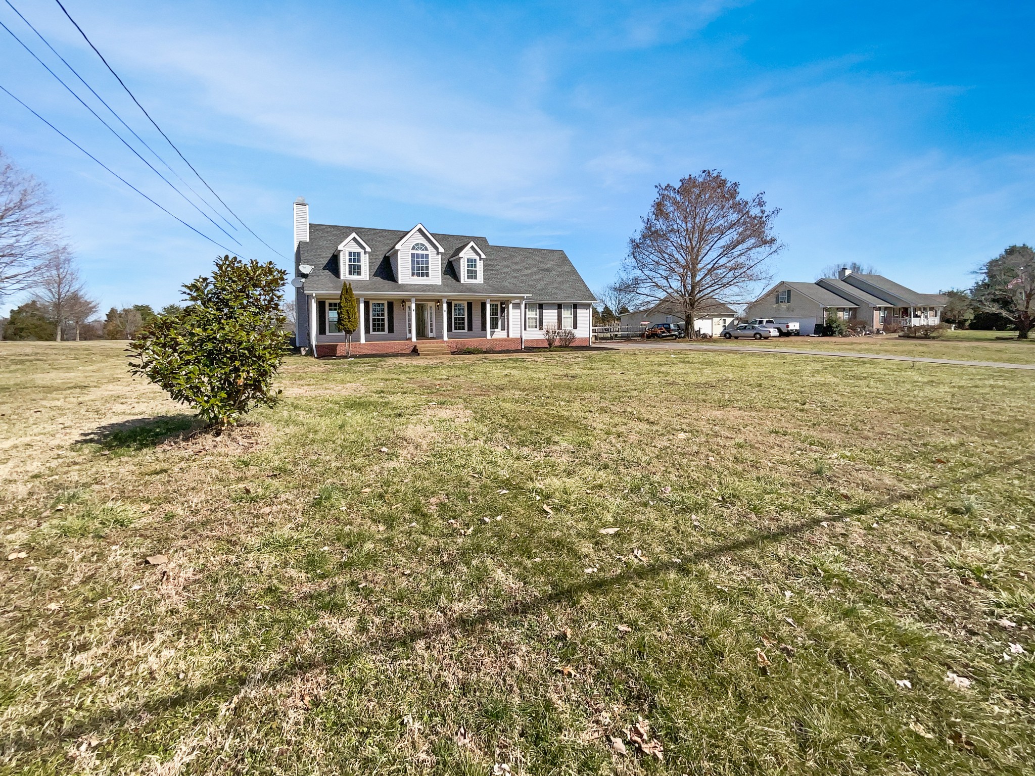 1683 South Walker Road Pleasant View, TN 37146 - Photo 10 of 26 a view of a large house with a big yard and large trees