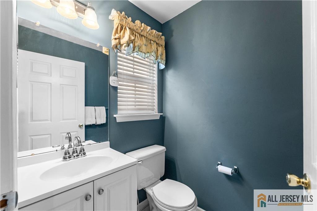 28 Garfield Way Princeton, NJ 08540 - Photo 20 of 39 a bathroom with a sink a toilet and mirror