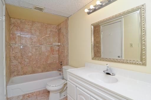 526 Inverrary Lane Deerfield, IL 60015 - Photo 4 of 7 a bathroom with a sink a toilet and a mirror