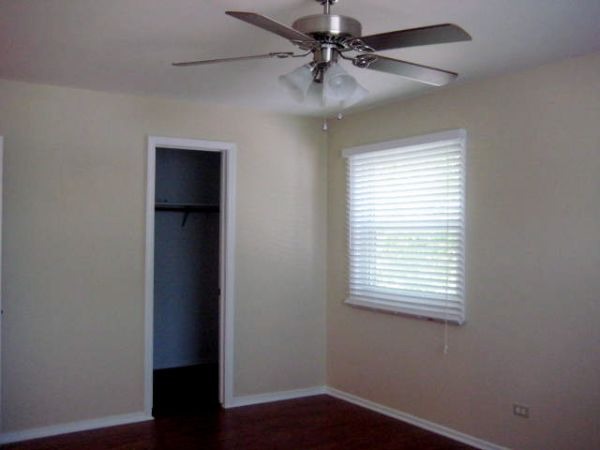 526 Inverrary Lane Deerfield, IL 60015 - Photo 5 of 7 an empty room with a window and a ceiling fan