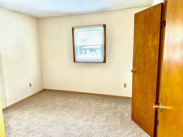 7809 Chase Street Merrillville, IN 46410 - Photo 12 of 33 an empty room with a door