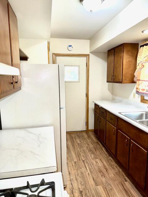7809 Chase Street Merrillville, IN 46410 - Photo 16 of 33 a kitchen with a refrigerator and a sink
