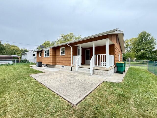 7809 Chase Street Merrillville, IN 46410 - Photo 28 of 33 a front view of a house with a yard