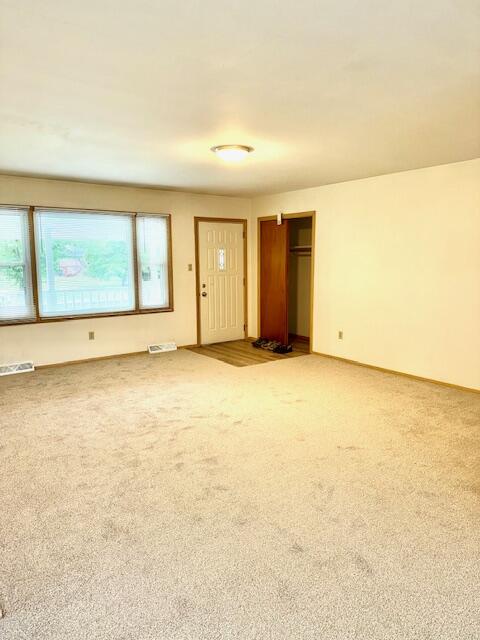 7809 Chase Street Merrillville, IN 46410 - Photo 5 of 33 an empty room with a empty space and windows