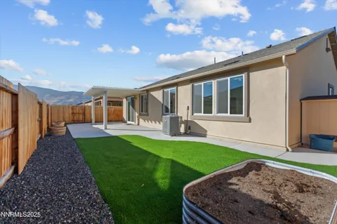 a view of a house with backyard and porch