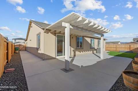 a view of a house with backyard and porch