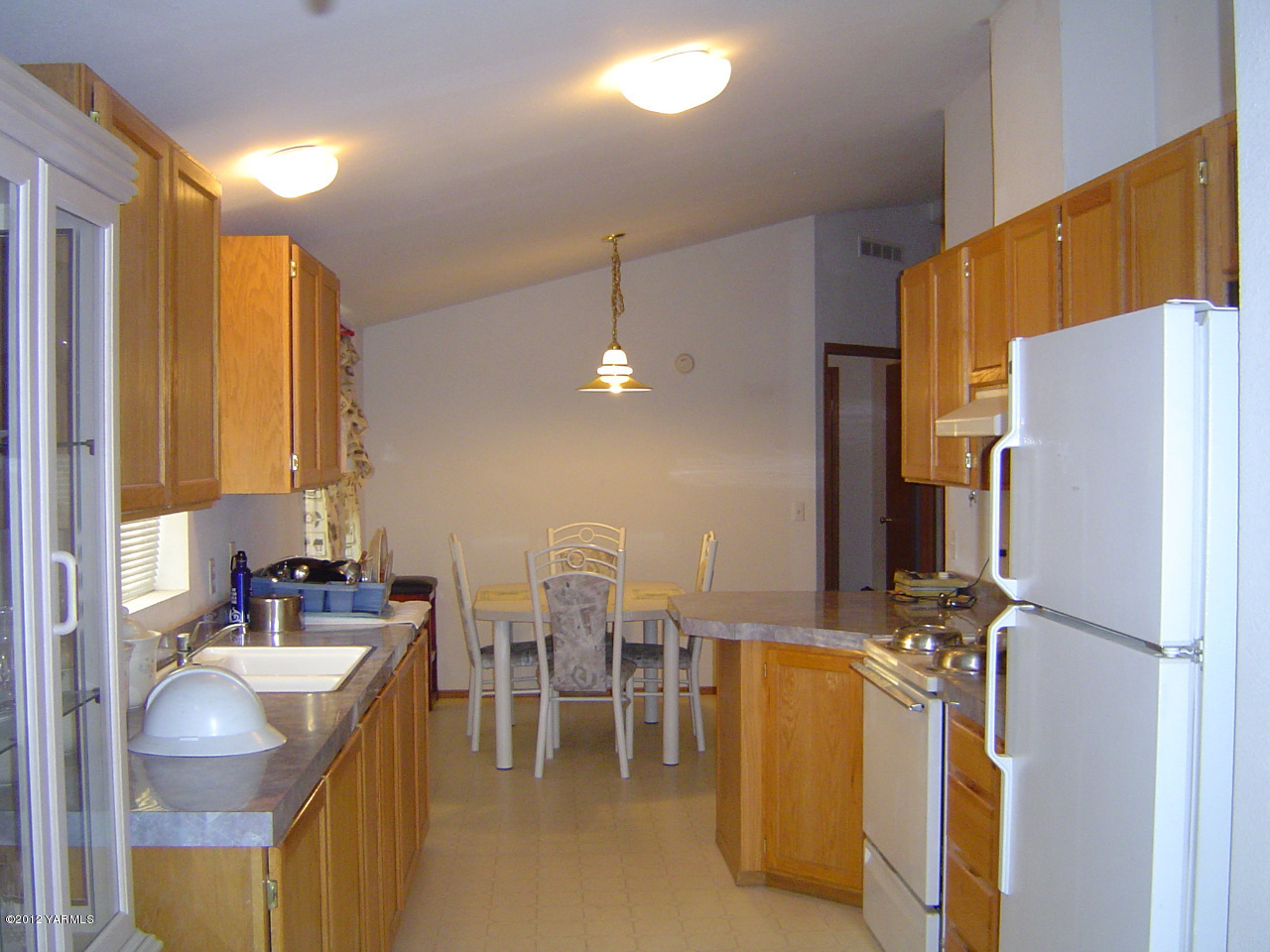 2810 Birchfield Road Yakima, WA 98901 - Photo 11 of 14 a kitchen with a refrigerator and sink