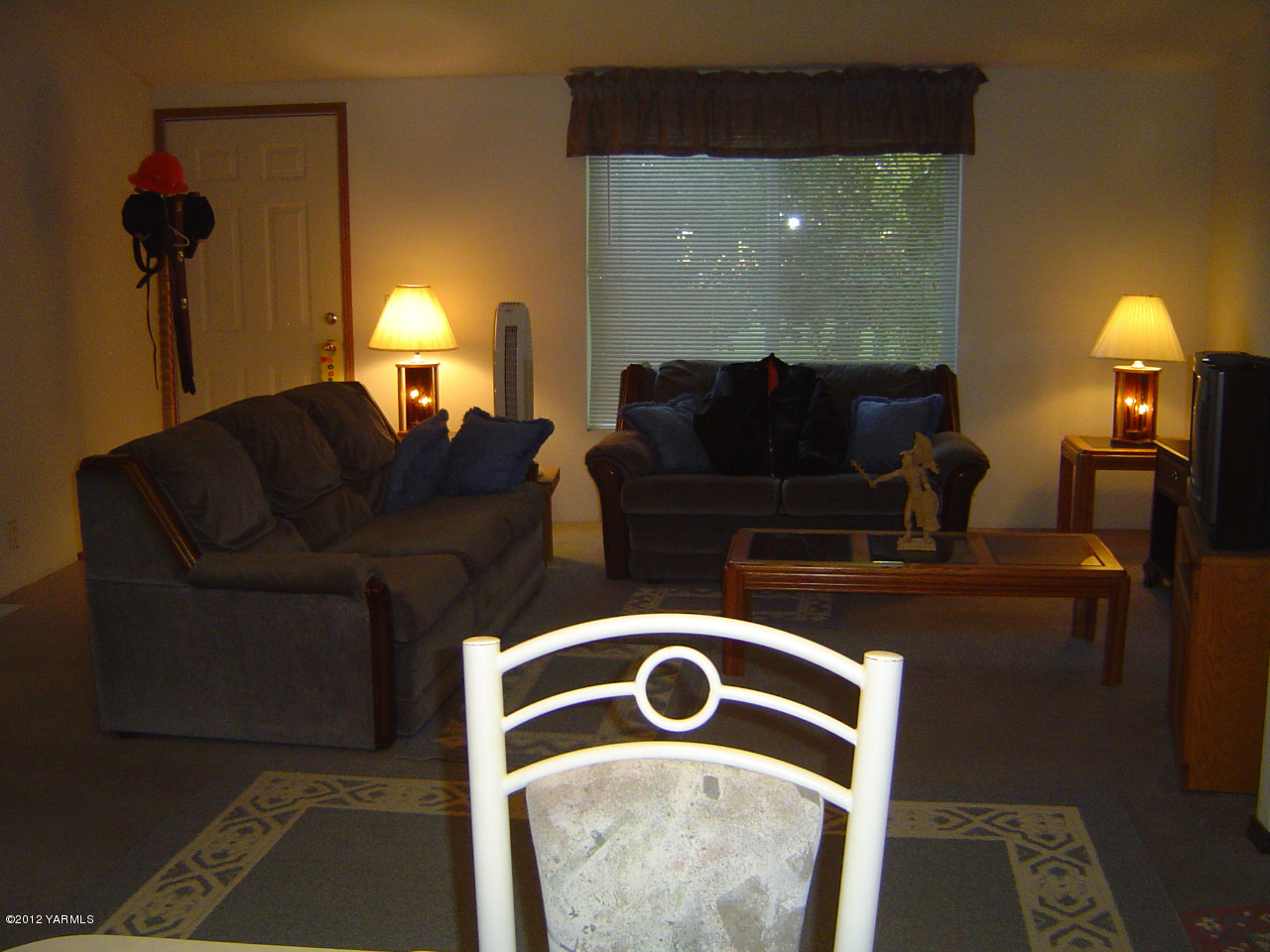 2810 Birchfield Road Yakima, WA 98901 - Photo 13 of 14 a living room with furniture and a lamp