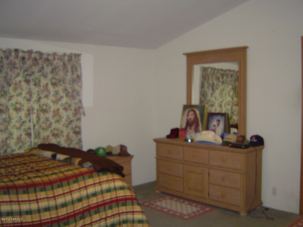 2810 Birchfield Road Yakima, WA 98901 - Photo 14 of 14 a bedroom with a bed and a dresser