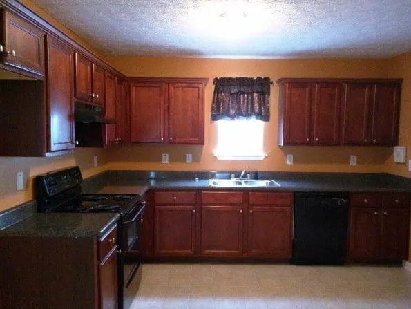 a kitchen with a sink and cabinets