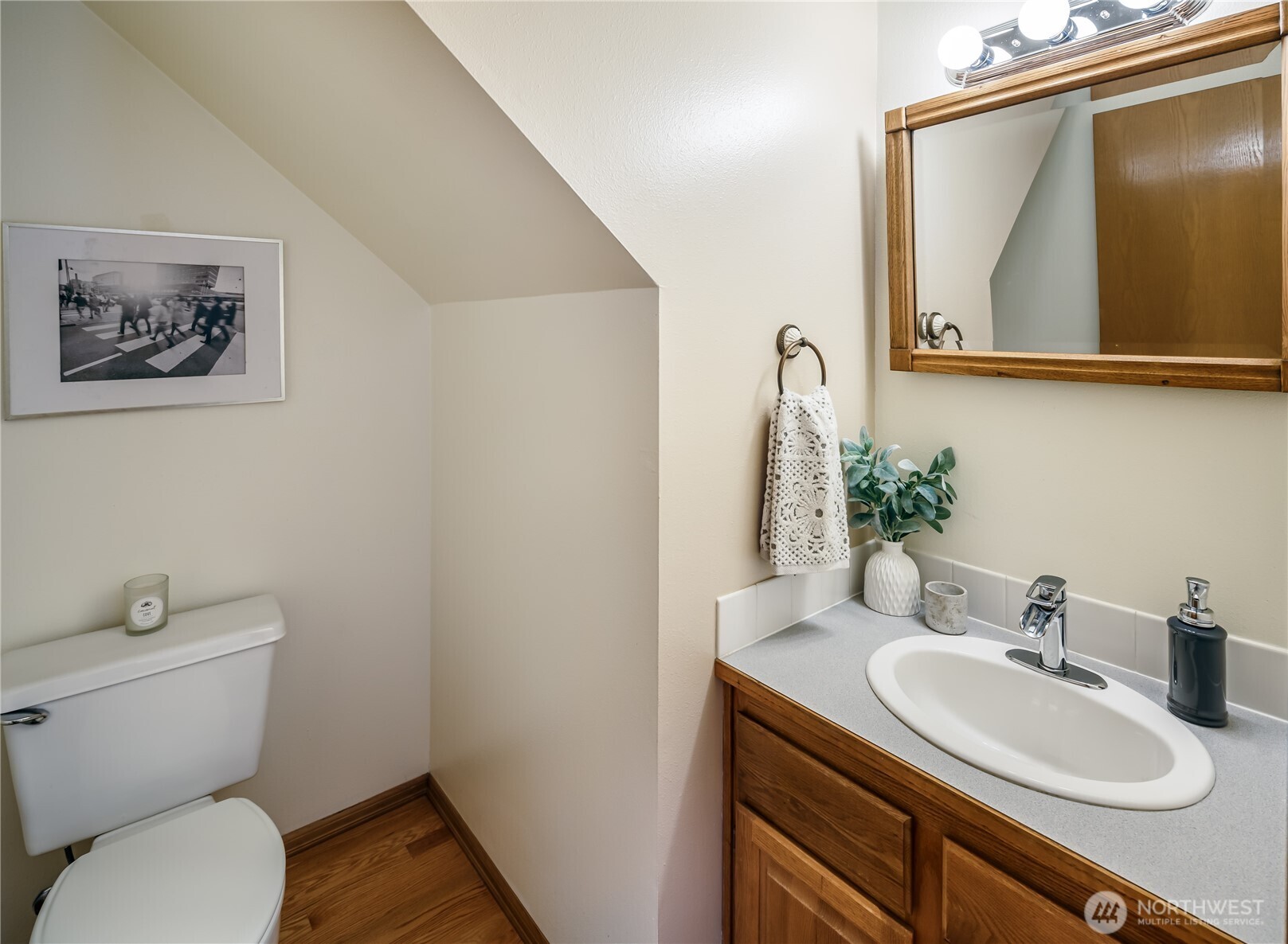 610 Glen Street, Unit 3 Edmonds, WA 98020 - Photo 12 of 19 a bathroom with a toilet sink and mirror