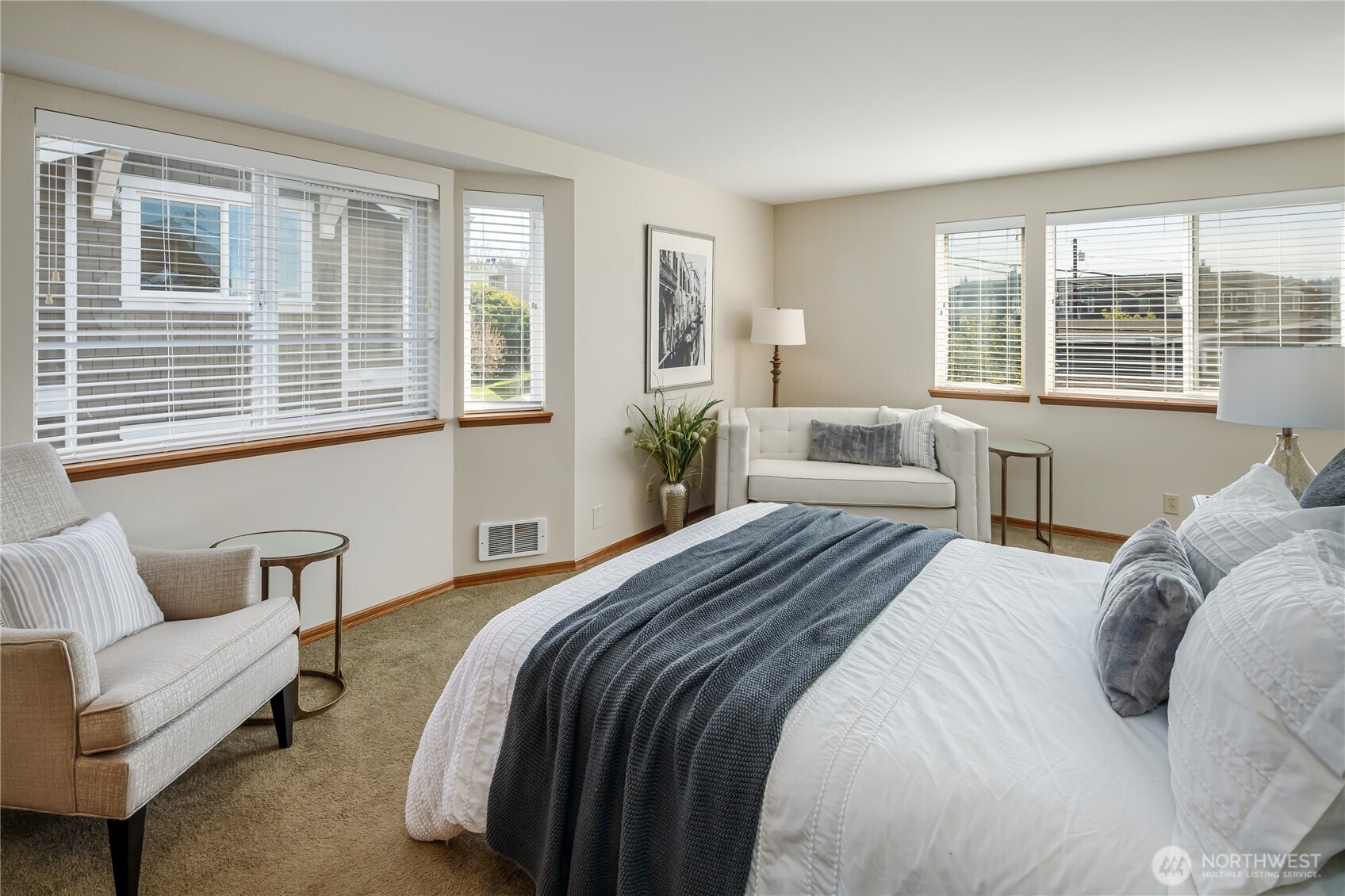 610 Glen Street, Unit 3 Edmonds, WA 98020 - Photo 13 of 19 a bedroom with a bed and wooden floor