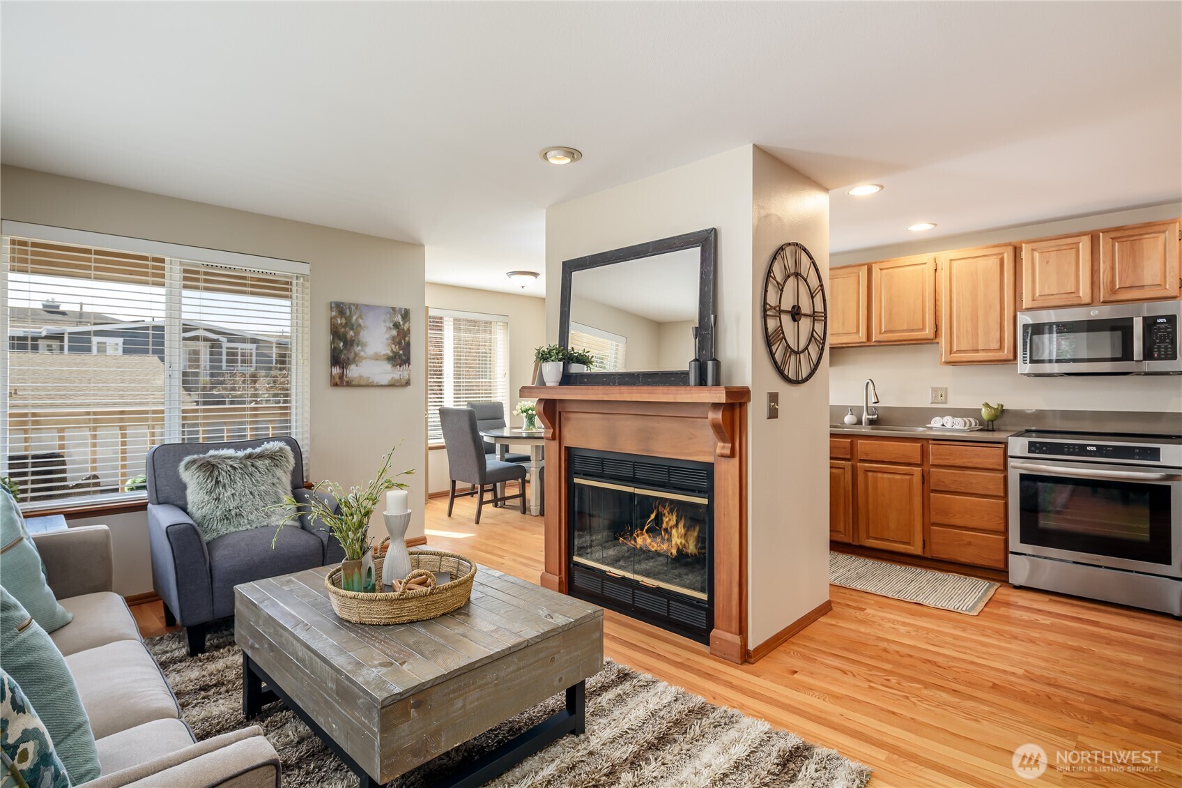 610 Glen Street, Unit 3 Edmonds, WA 98020 - Photo 6 of 19 a living room with furniture and a fireplace