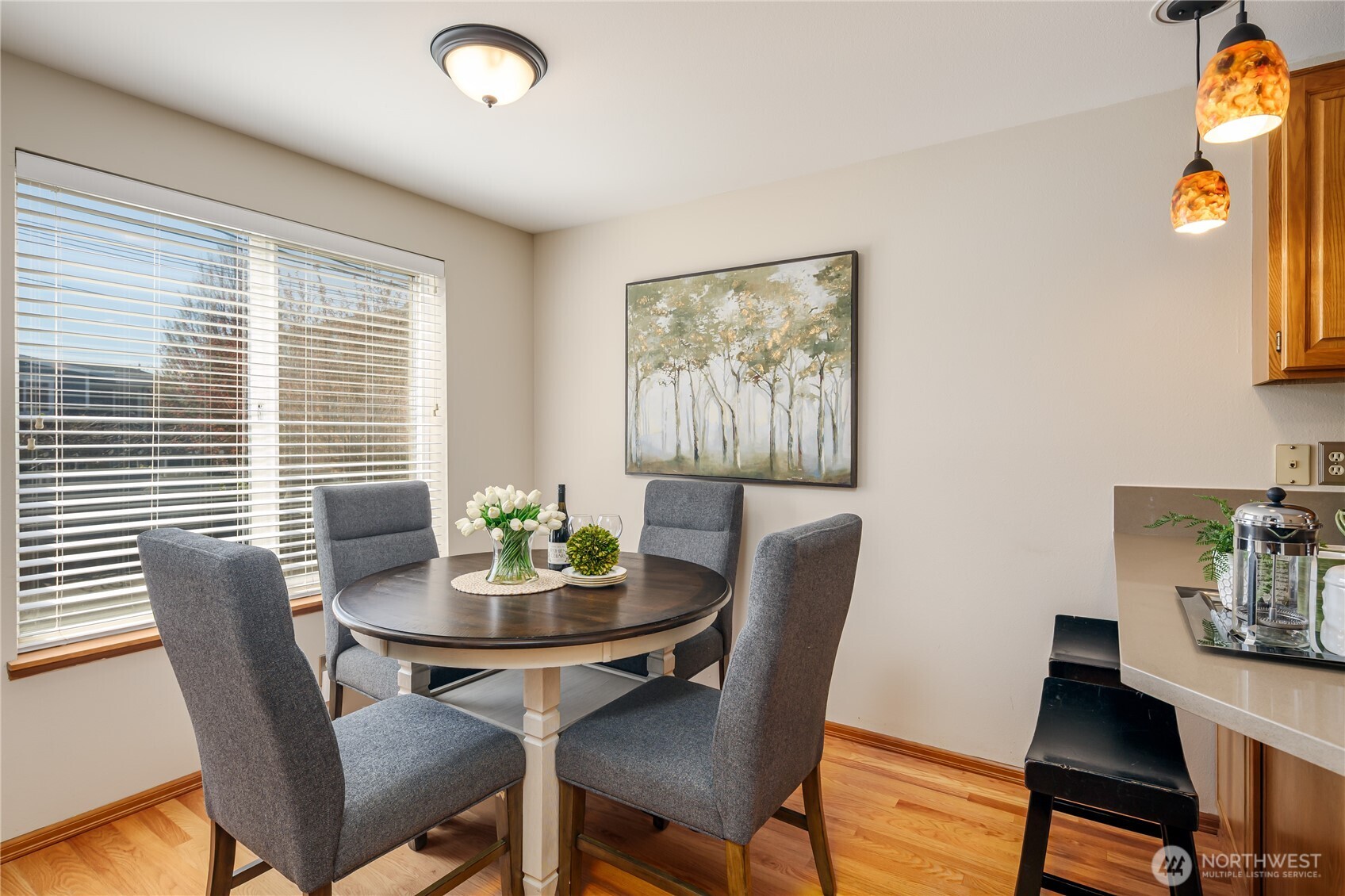 610 Glen Street, Unit 3 Edmonds, WA 98020 - Photo 9 of 19 a view of a dining room with furniture and wooden floor