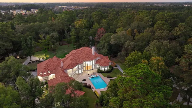 an aerial view of a house with a garden