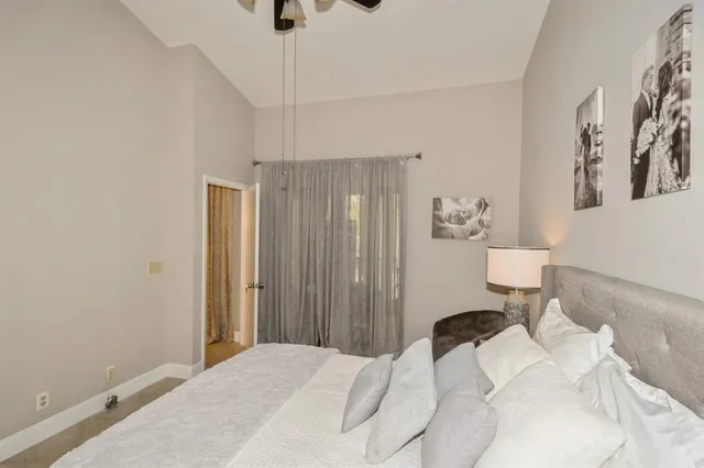 a bedroom with a bed and a couch