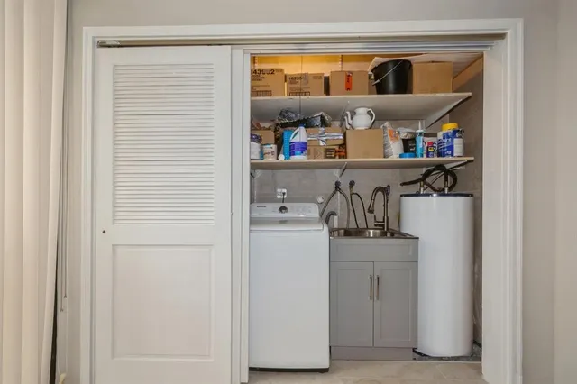 a kitchen with a refrigerator and cabinets