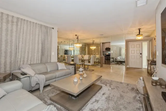 a living room with furniture and a table