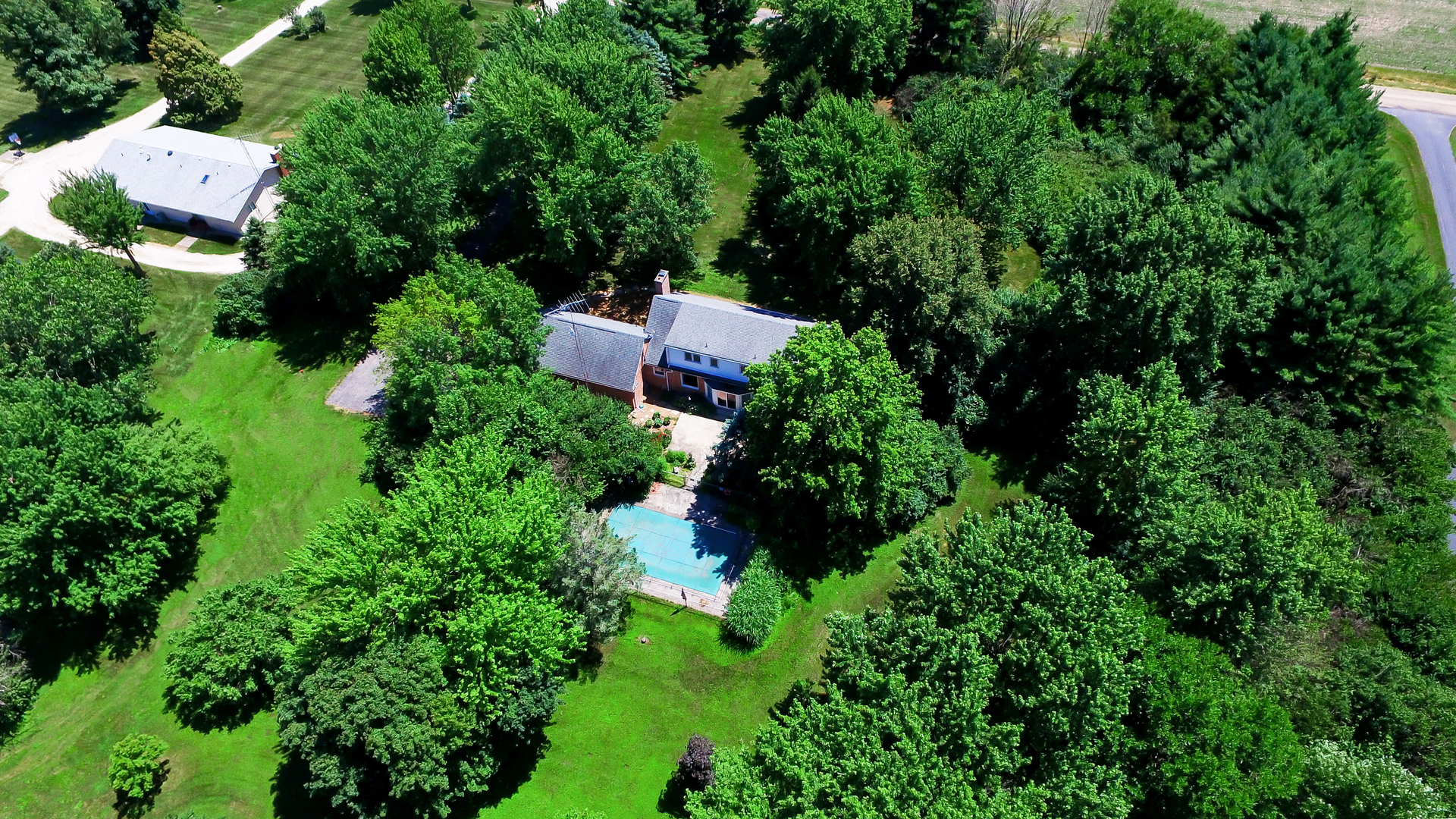 1870 Scully Road Dwight, IL 60420 - Photo 2 of 29 an aerial view of a house with pool outdoor space and trees all around