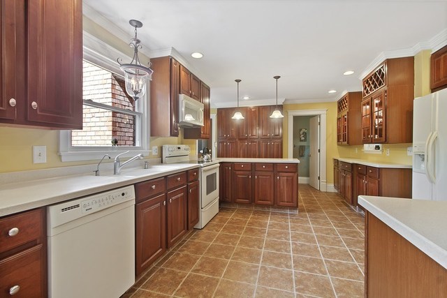 1870 Scully Road Dwight, IL 60420 - Photo 6 of 29 a large kitchen with a large counter top a sink a window and stainless steel appliances