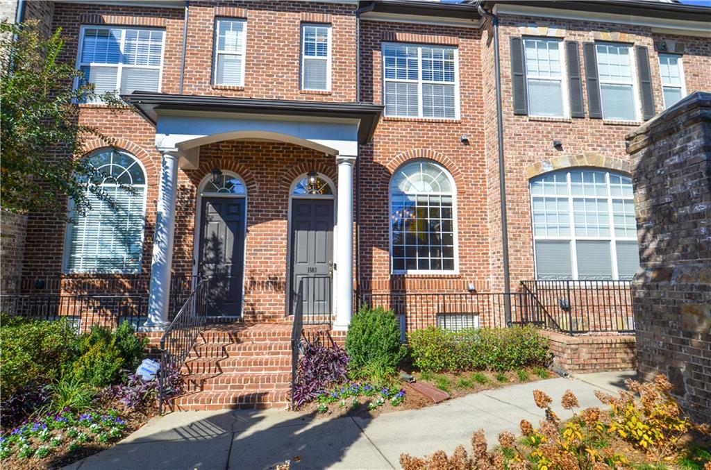 1603 Rivers Edge Trail Northeast Atlanta, GA 30324 - Photo 1 of 1 a front view of a house with a garden