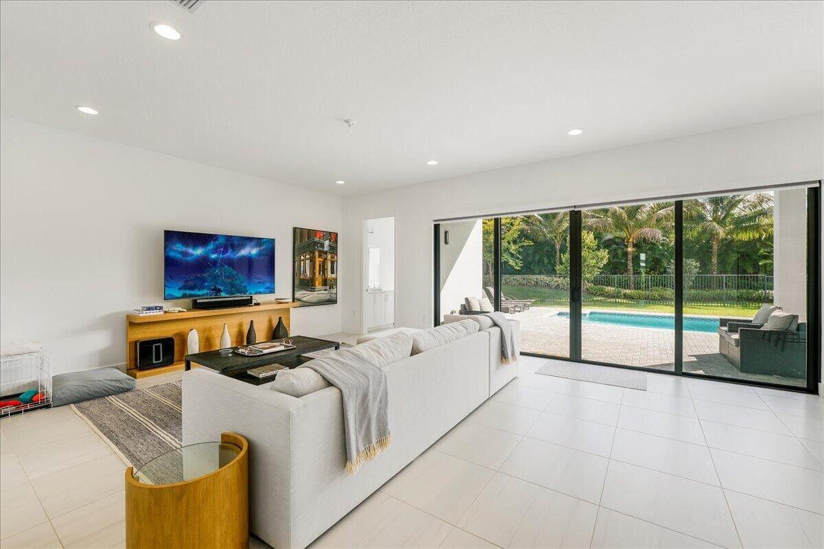 17496 Sparkling River Road Boca Raton, FL 33496 - Photo 14 of 36 a living room with furniture and a large window