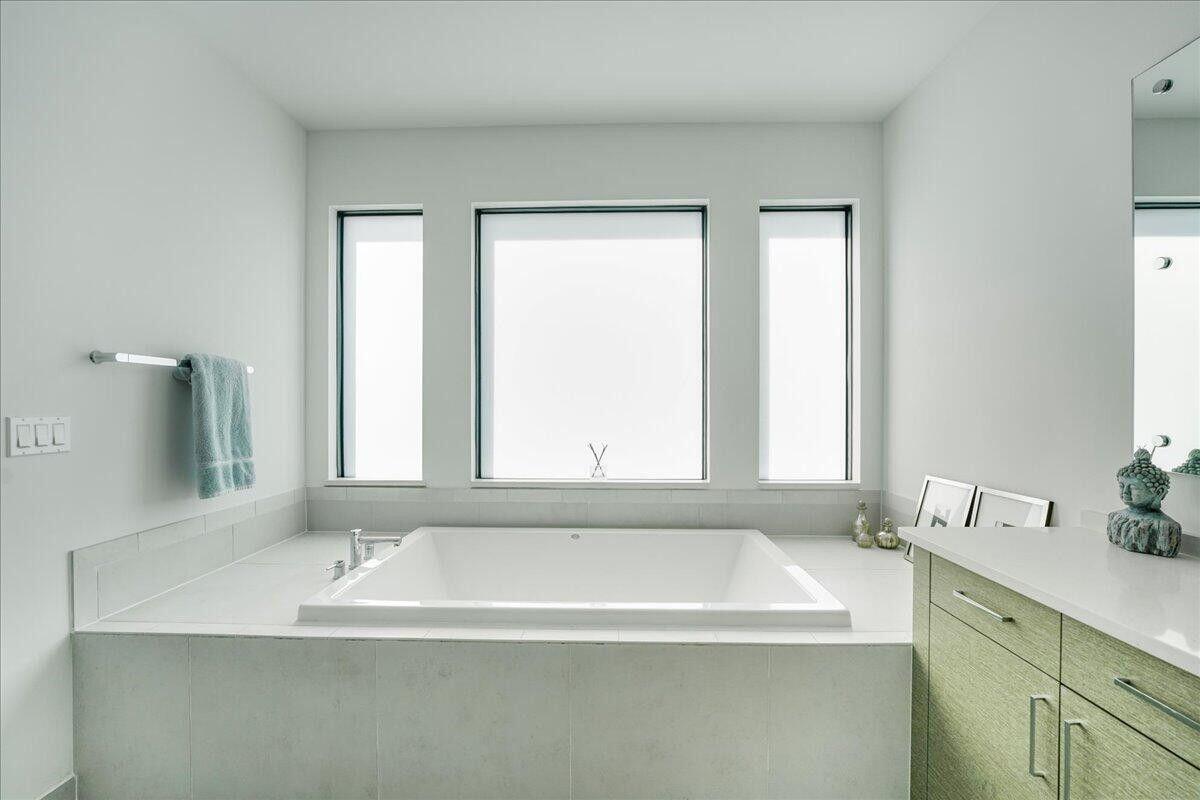 17496 Sparkling River Road Boca Raton, FL 33496 - Photo 22 of 36 a white bath tub sitting next to a window