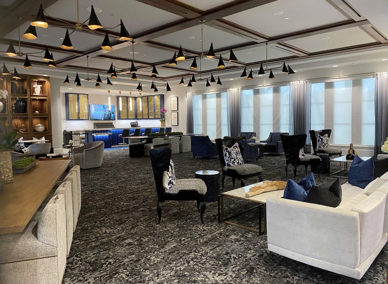 17496 Sparkling River Road Boca Raton, FL 33496 - Photo 34 of 36 a living room with lots of furniture and a chandelier