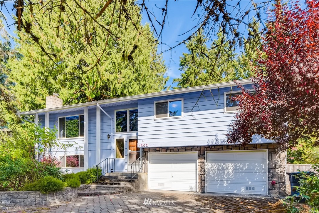 1823 224th Street Southwest Bothell, WA 98021 - Photo 2 of 27 a front view of a house with garden
