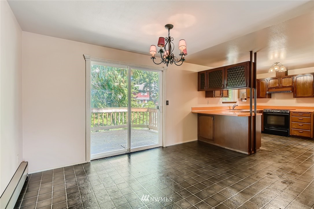 1823 224th Street Southwest Bothell, WA 98021 - Photo 16 of 27 a view of a kitchen with a sink and dishwasher kitchen view