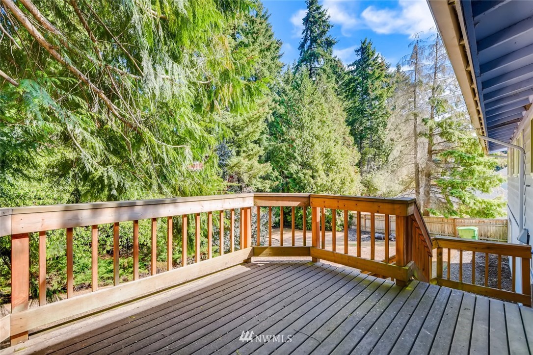 1823 224th Street Southwest Bothell, WA 98021 - Photo 4 of 27 a view of wooden balcony with trees