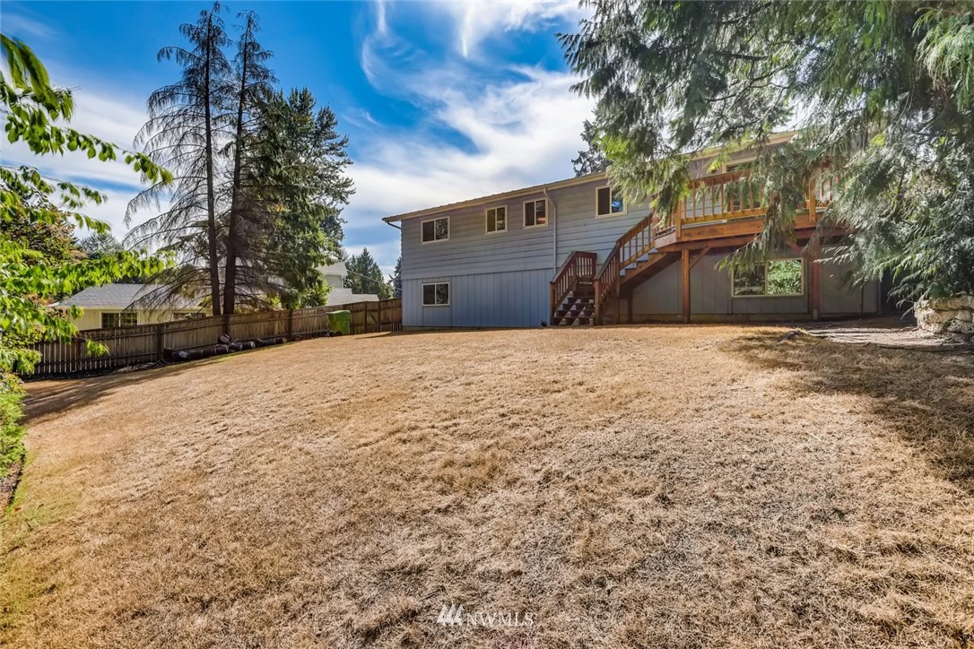 1823 224th Street Southwest Bothell, WA 98021 - Photo 6 of 27 a front view of a house with a yard