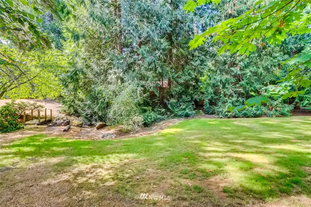 1823 224th Street Southwest Bothell, WA 98021 - Photo 10 of 27 a view of yard with swimming pool and green space