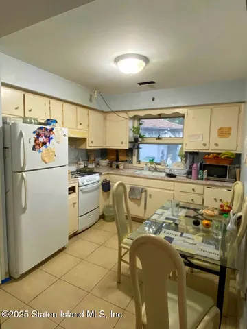 a bedroom with furniture and a flat screen tv